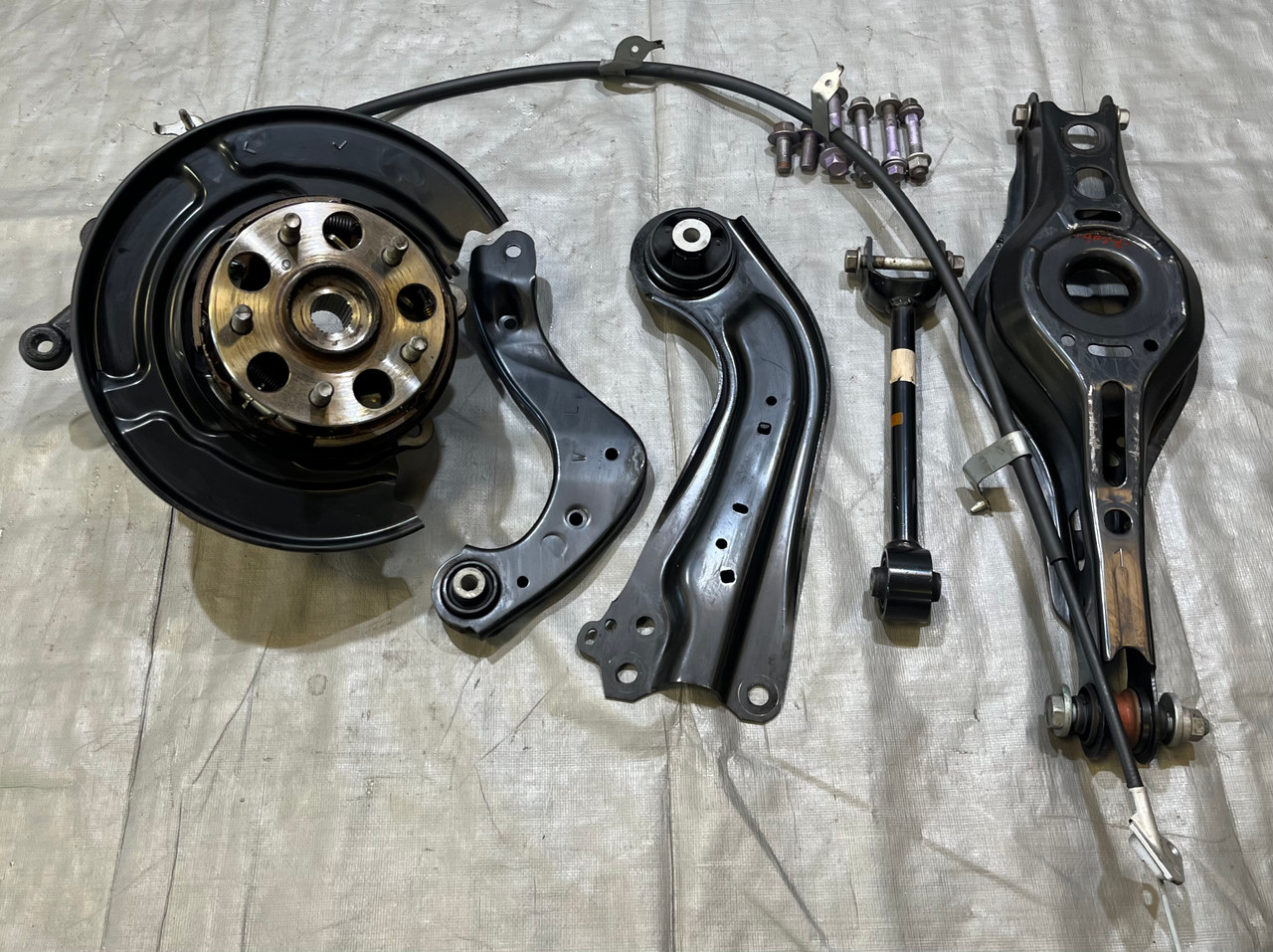 2023-2025 Toyota GR Corolla Driver Rear Knee Hub Assembly w/ Control Arms / 31K GRC02 2023-2025 Toyota GR Corolla Driver Rear Knee Hub Assembly w/ Control Arms / 31K GRC02